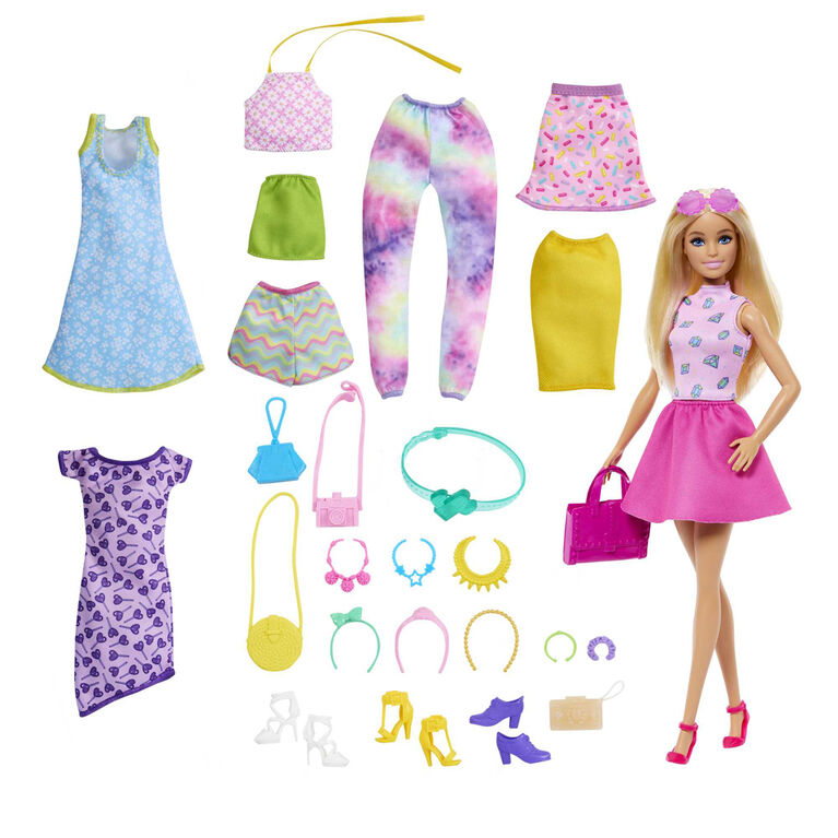 Barbie doll with a variety of clothing items and accessories on a white background