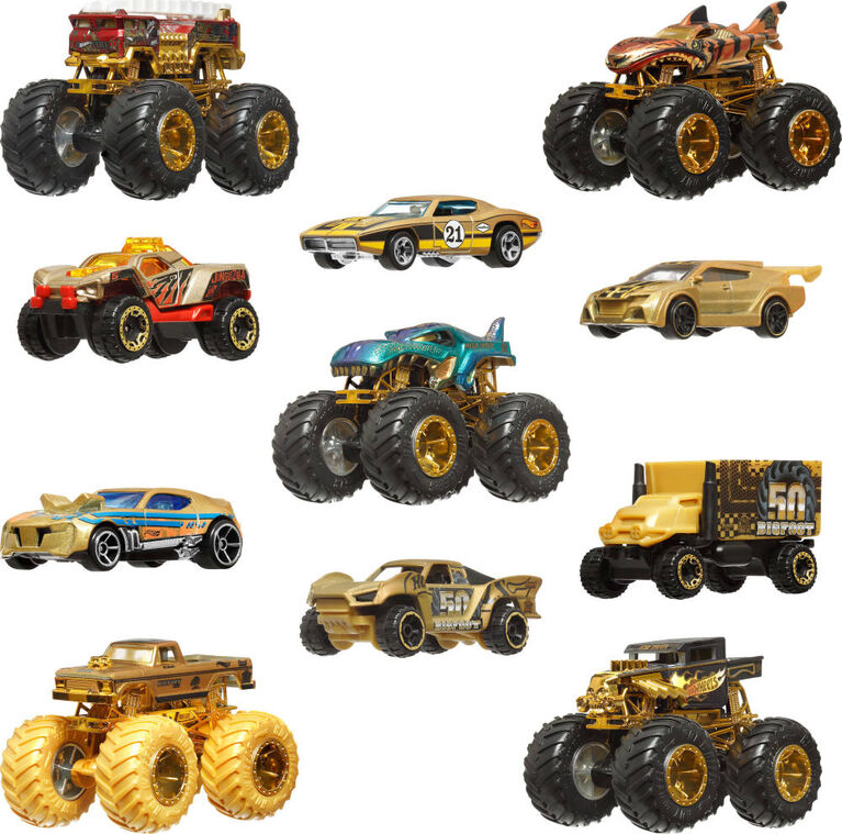 Collection of toy monster trucks and cars on a white background