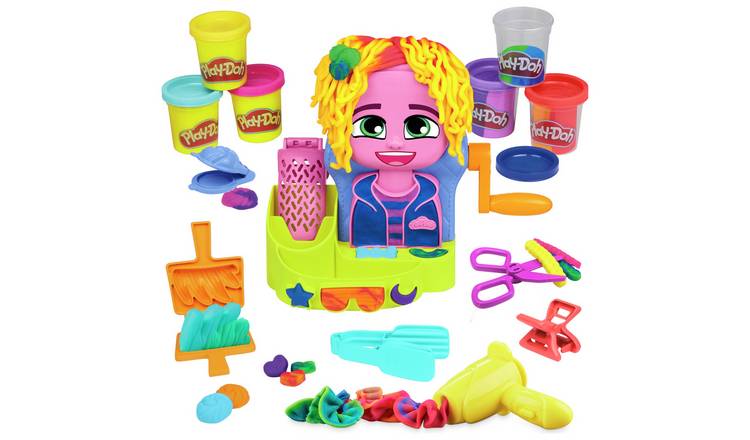 Play-Doh toy set with character and tools on a white background