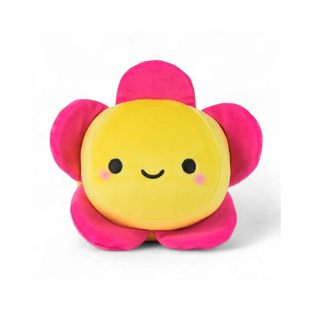 Flower-shaped plush toy with a yellow center and pink petals on a white background