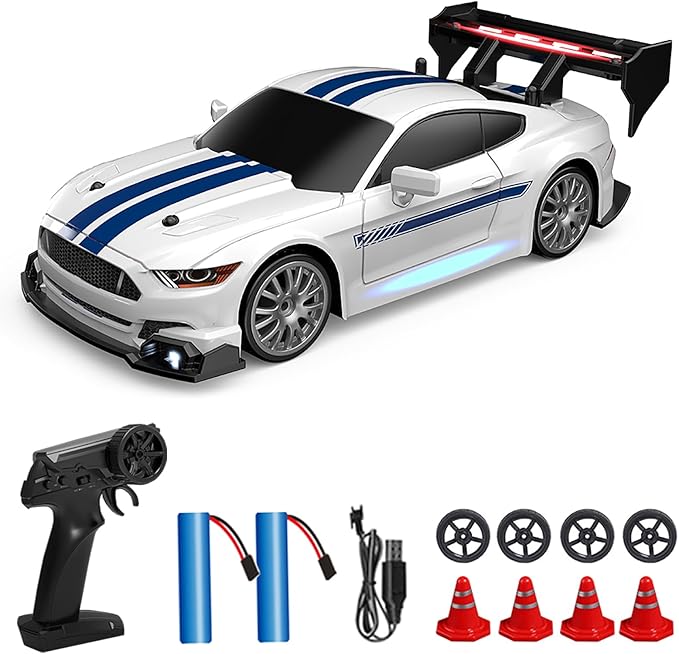 White RC car with blue stripes, remote control, batteries, and cones on a white background