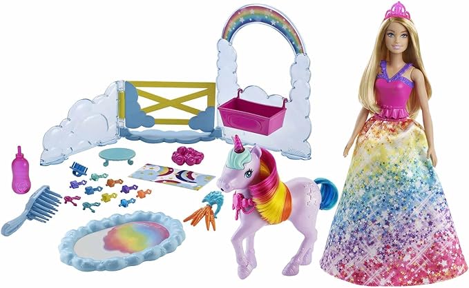 Barbie doll with rainbow dress and unicorn toy set on a white background