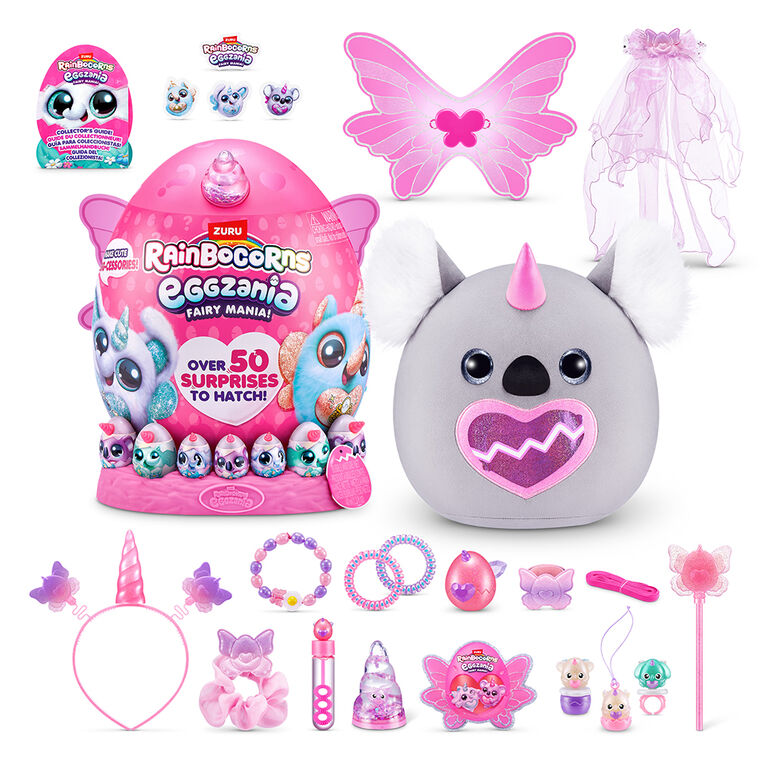 Collection of toys including a gray creature with a pink heart, packaging, and various accessories on a white background.
