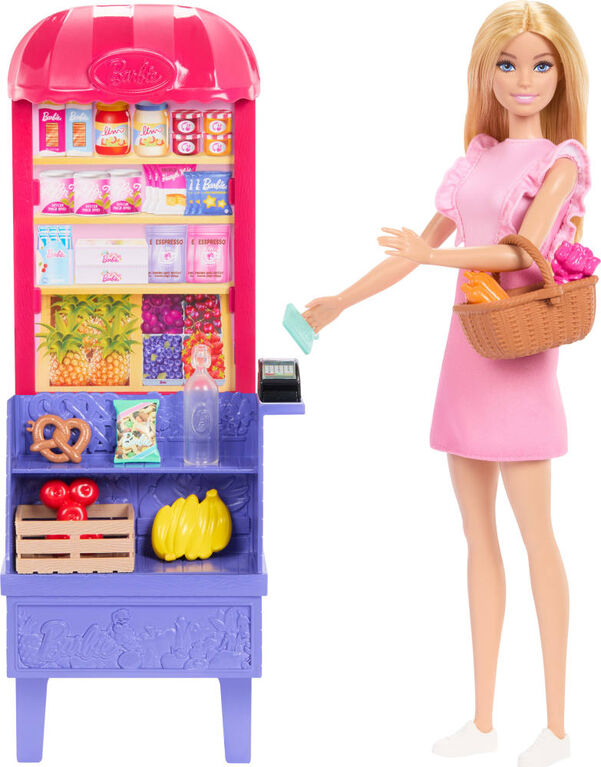 Barbie doll with a grocery store playset and items