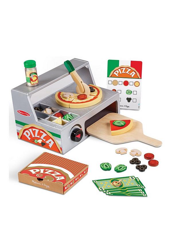 Toy pizza oven set with pizza ingredients on a white background