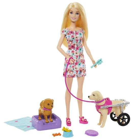 Barbie doll with a dog and wheelchair on a white background